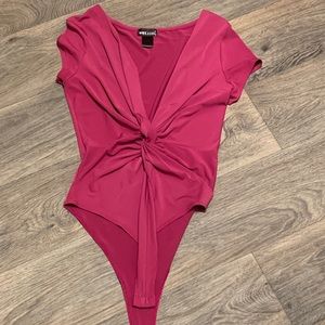 Wet Seal Fuschia One piece with sexy low cut